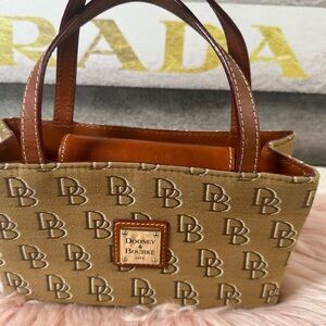 Dooney & Bourke mini bag with a tan and brown monogrammed canvas body, vintage